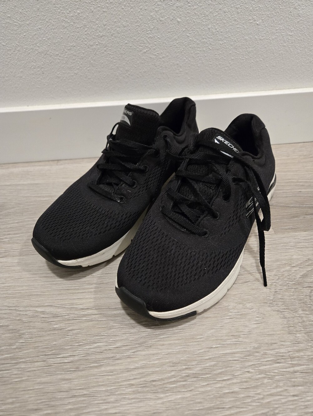 Skechers Womens Black Athletic Knit Sneakers with White Soles